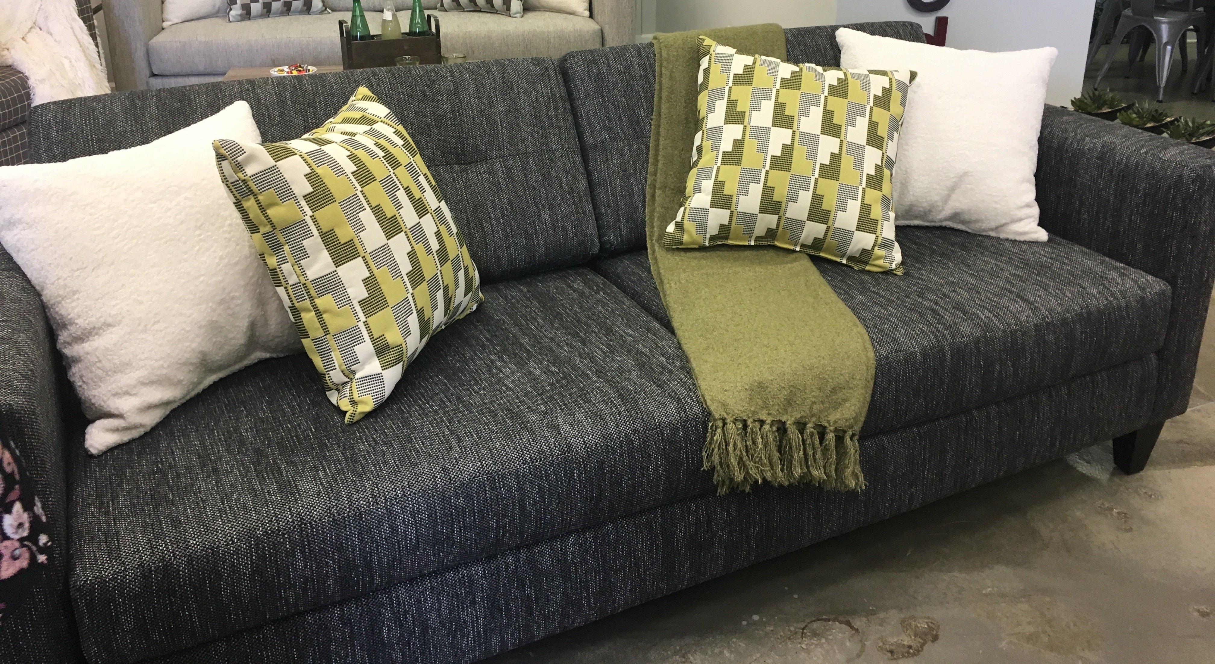 Dark grey shop sofa with cushions